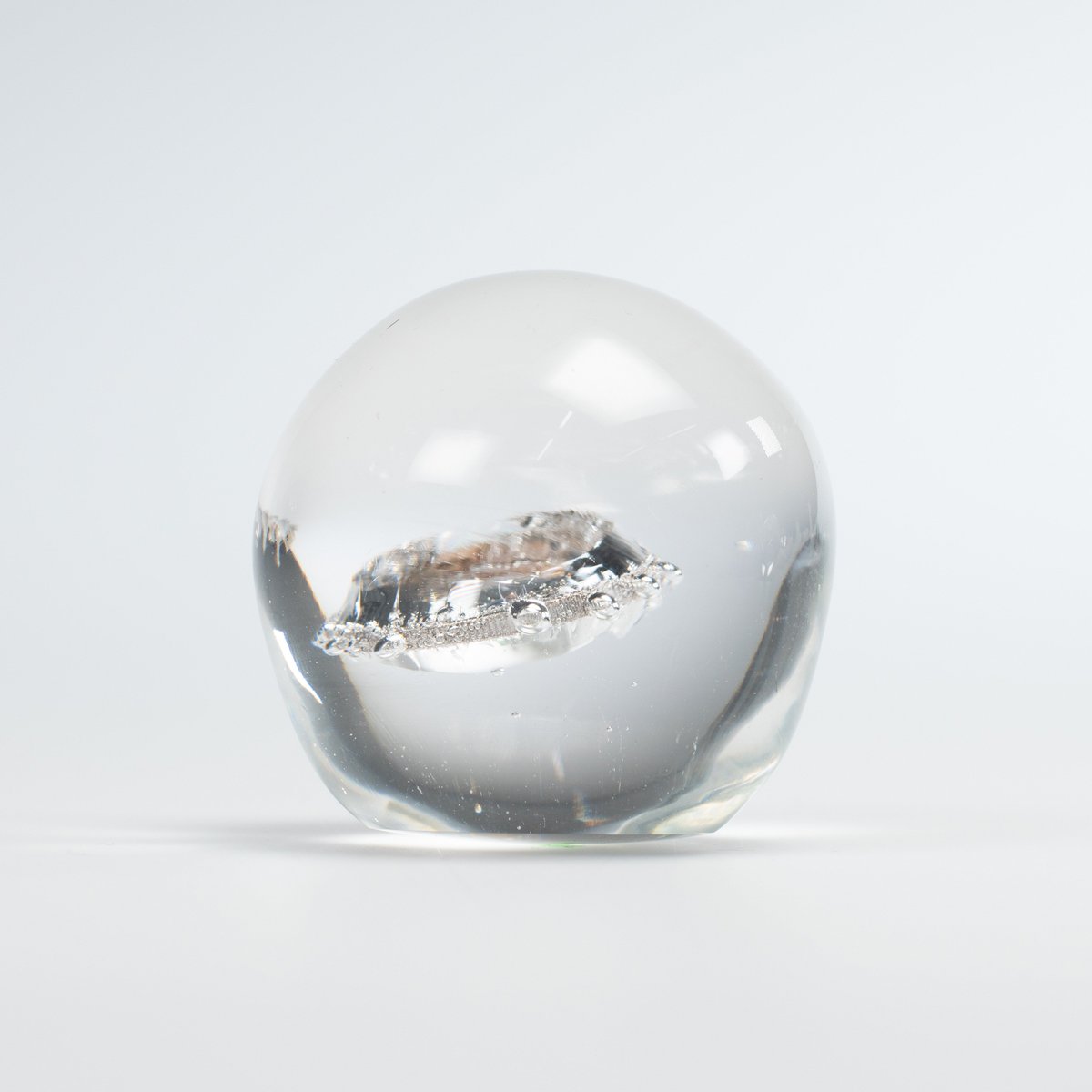 scopeforimpact's tweet photo. Girls in many countries are coerced by men for sex in exchange for money. #FutureFossils are expressions of the present seeking to become things of the past. This object with coins fossilized in glass shows how vulnerability is exploited in many ways. ➡️ https://t.co/QOFV6fRca0 https://t.co/0O0DxT9t5z