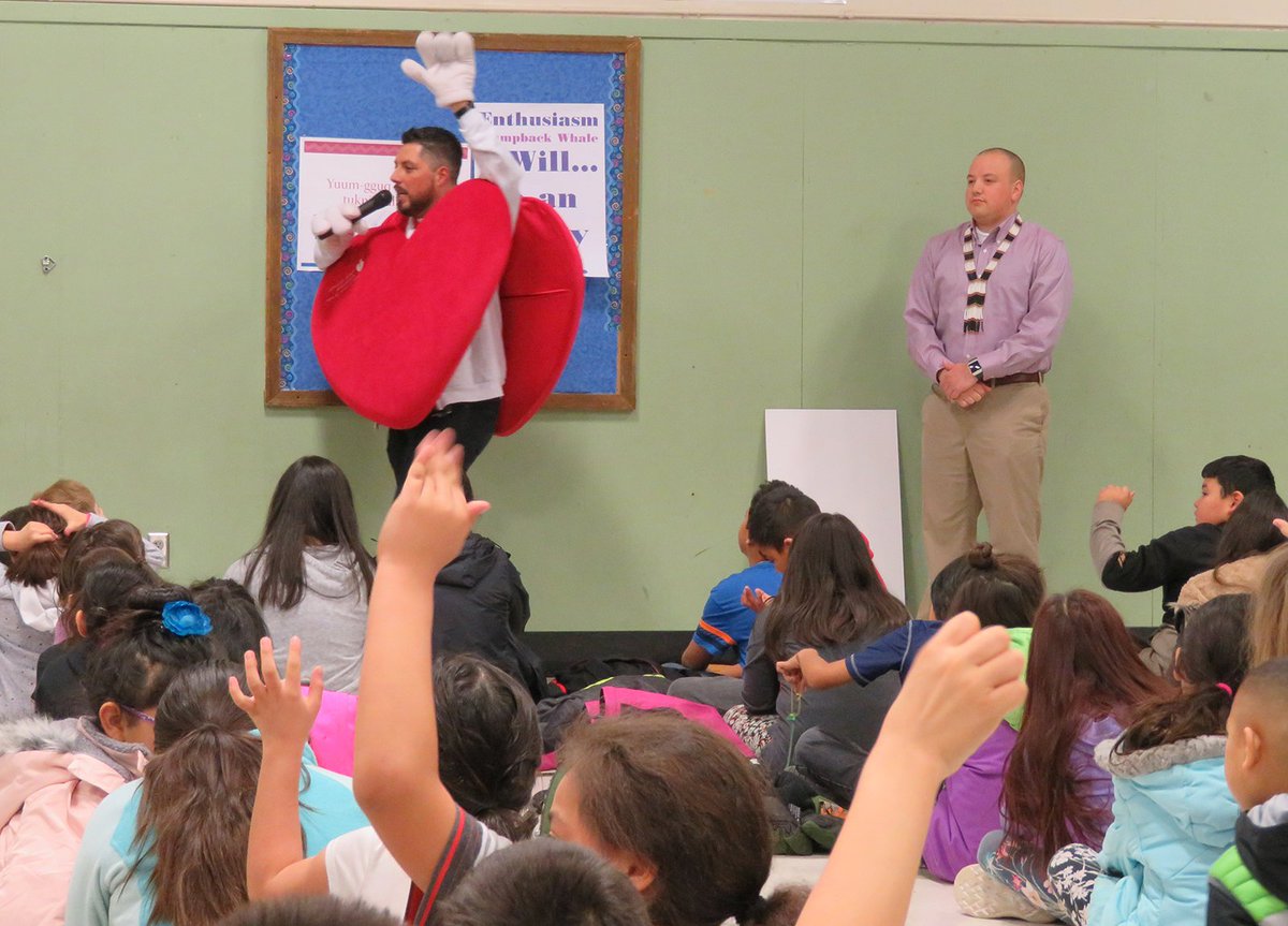 Stantec's tweet photo. Our #Alaska team is #StantecProud to sponsor the Alaska Native Cultural Charter School for the @AlaskaAHA #AlaskaHeartRun. Today, Adam Leggett delivered a check to Dustin Morris so all ANCCS students can join the run! Watch @Ch2KTUU & @ktva tonight for more from the school. https://t.co/ndwaiBxBZB
