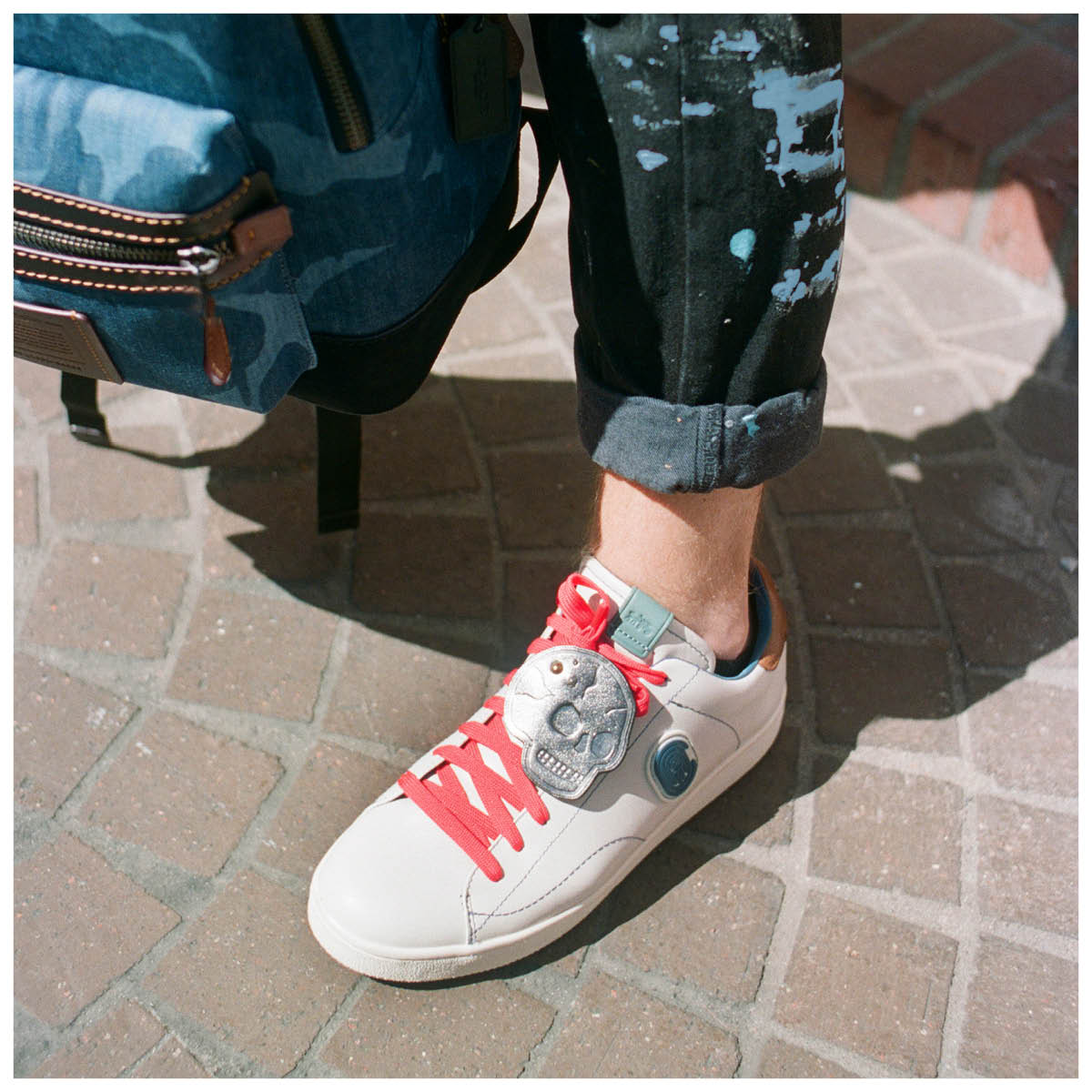 Coach's tweet image. What goes great with your favorite paint-splattered jeans? Whatever you want, of course. For LA-based artist #AndrewCooper, that meant pink laces and skull patches. How will you give a personal kick to our C101's? #CoachCreate #CoachNY on.coach.com/NewCoachCreate