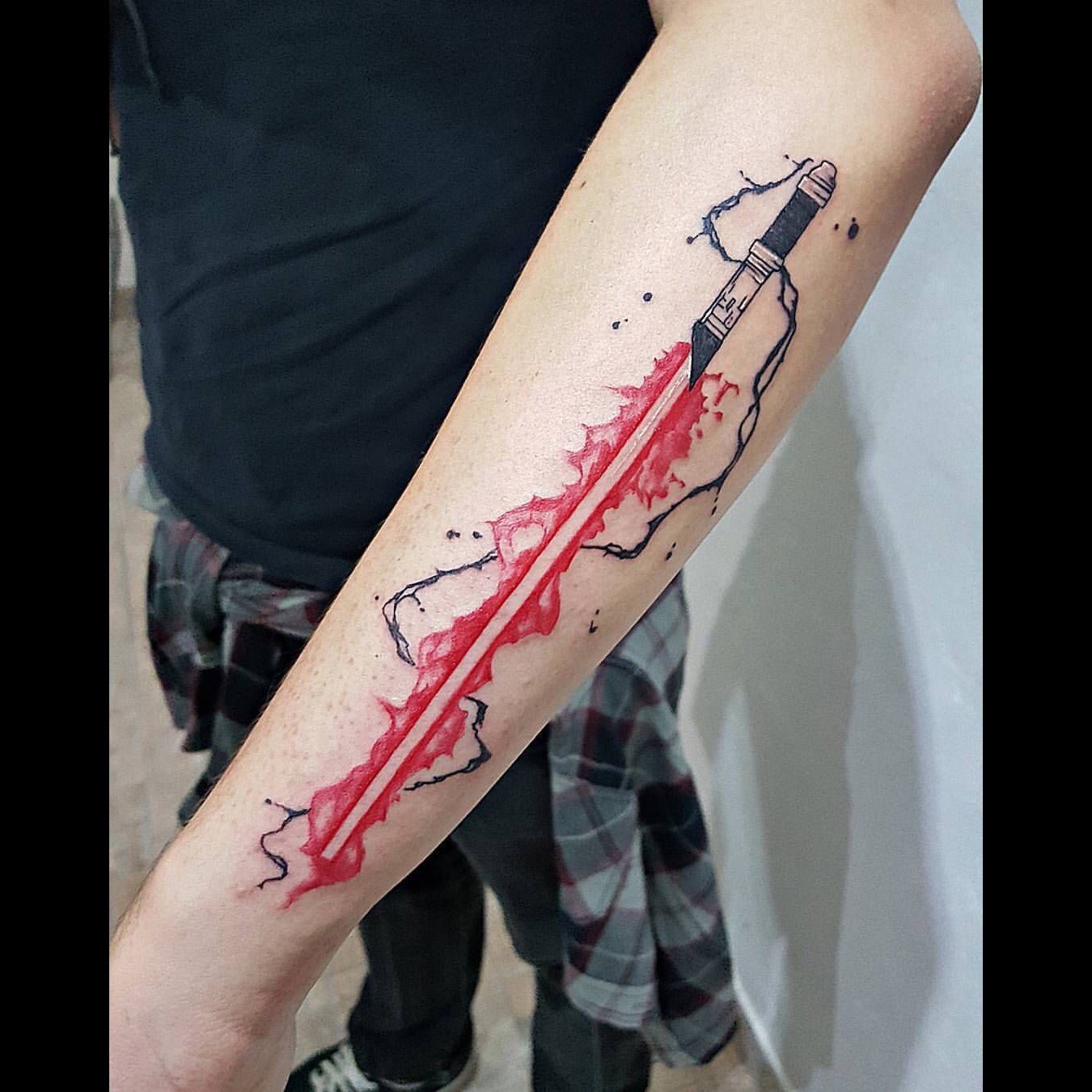 Just got a lightsaber tattoo to add to an old scar Might get a UV light  tattoo that glows blue later  rStarWars