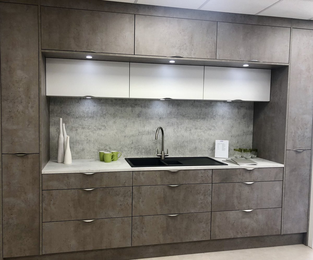 Loving this new concrete effect kitchen display it has inline handles and is just so neat #kitchendesign #exeter