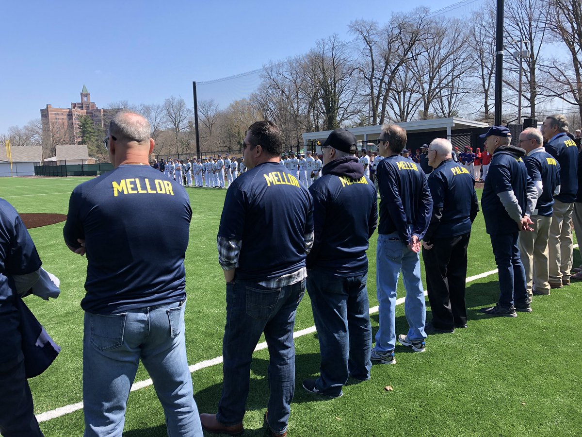 PennCharter's tweet photo. Former players line up on third base line wearing shirts bearing their coach’s name. #PalaiaField #HowFarPC https://t.co/ZUIVsUmThq