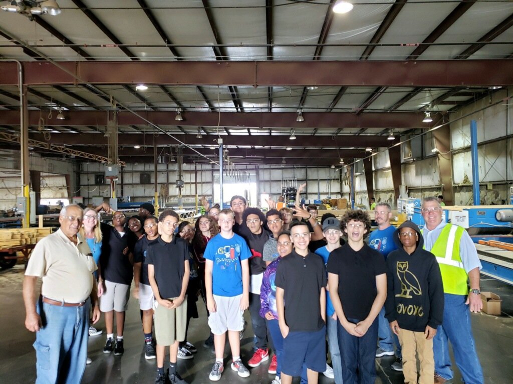 GrecoSTEM's tweet photo. Greco STEM 7th graders seeing engineering at work, from the ground up, literally. Thank you @BldrFirstSource for hosting our young learners at your Truss Plant @Grecoms https://t.co/3Dz0AkINVW