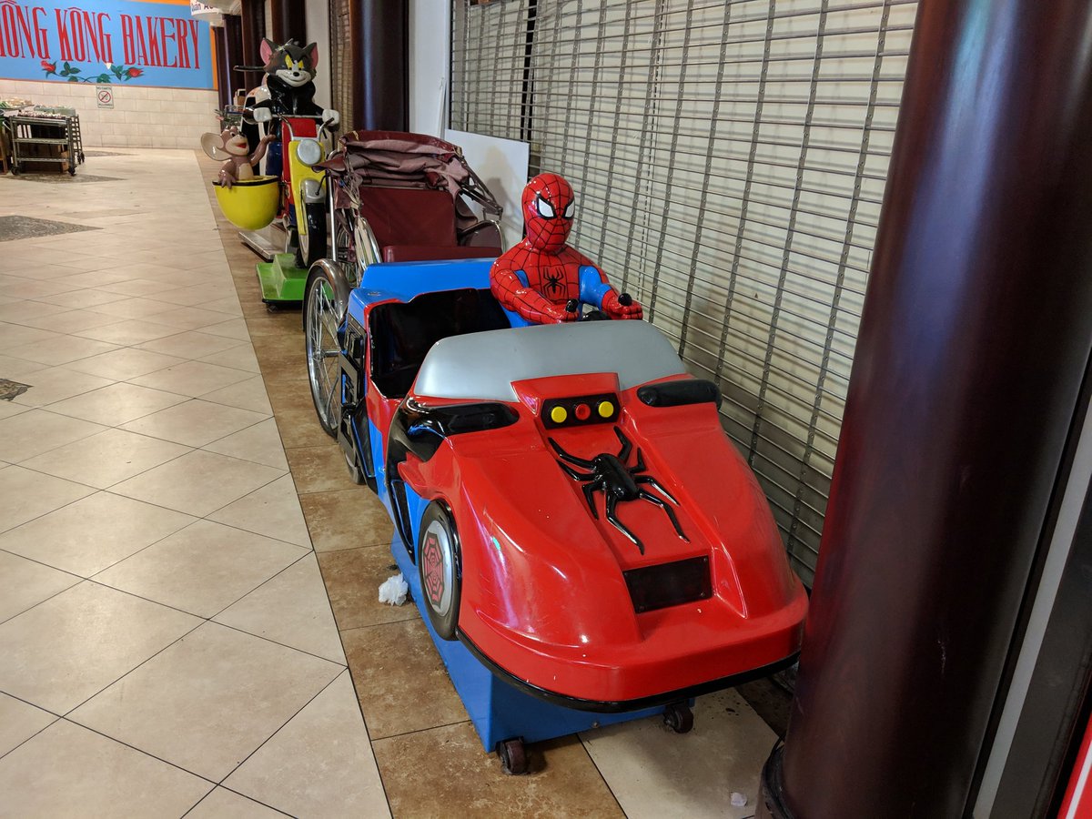 spiderman riding car