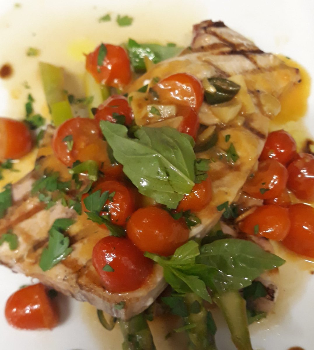 Sword fish steak with fresh cherry tomatoes and asparagus in a spicy white wine sauce. 
#Italian #restaurant #food #wine
friendsofflavours.london
