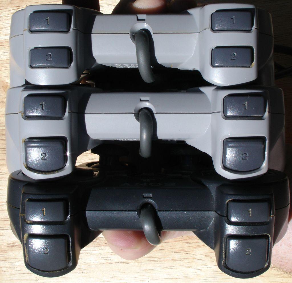 The PlayStation controller was followed by the Dual Analog controller (grey with the thumbsticks), and then the DualShock controller (black with thumbsticks). The thumbsticks allow for more precise and fluid controls, while the DualShock adds vibration