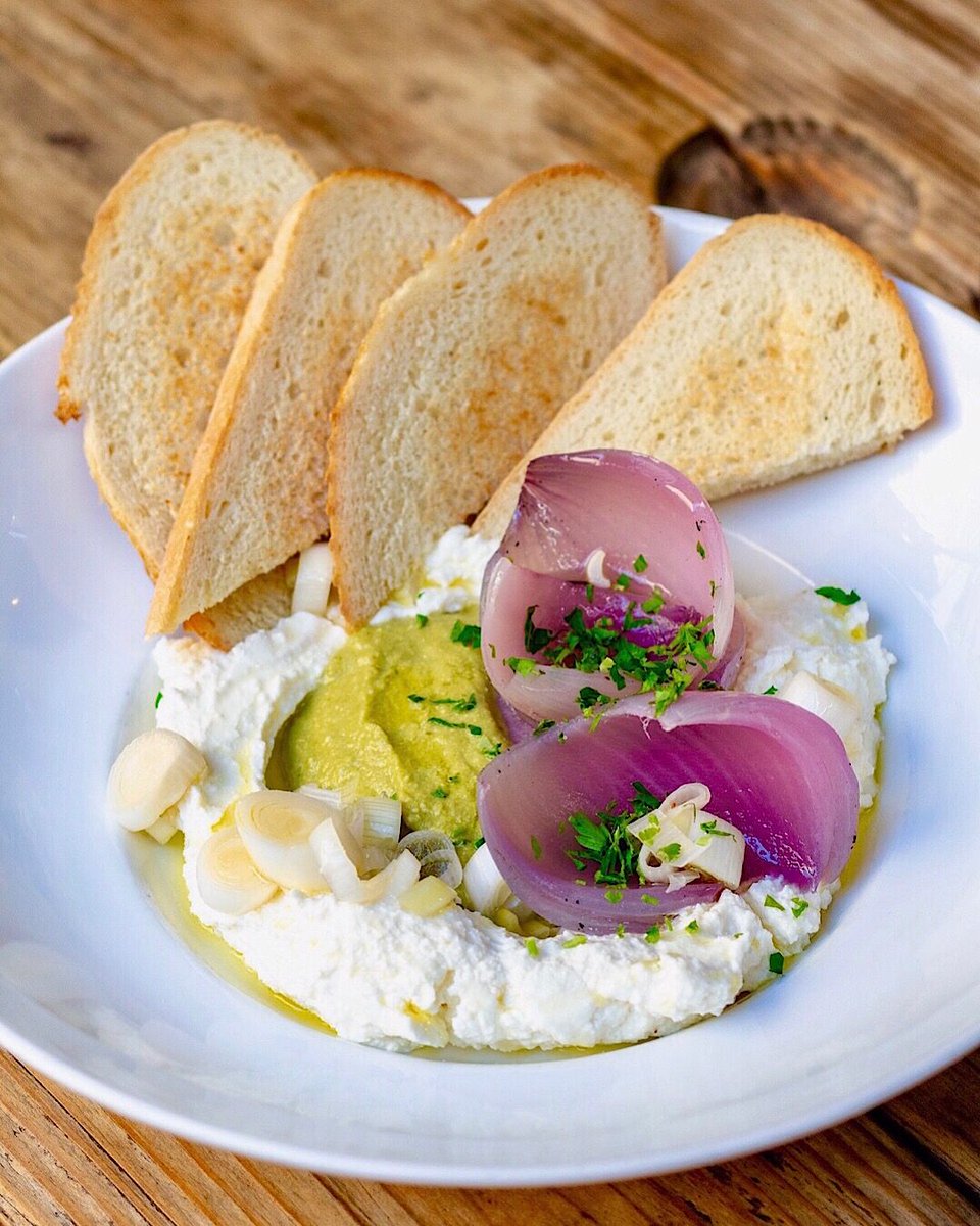 New housemade ricotta appetizer inspired by our sous chef, Jordan's recent trip to England 🇬🇧 Tender caramelized onions on a slow 3 hour grill. Pickled spring onions and gazpacho verde: a puree of spring onion &amp; spring garlic tops w/ vegetable stock &amp; hazelnuts. #hookandladder
