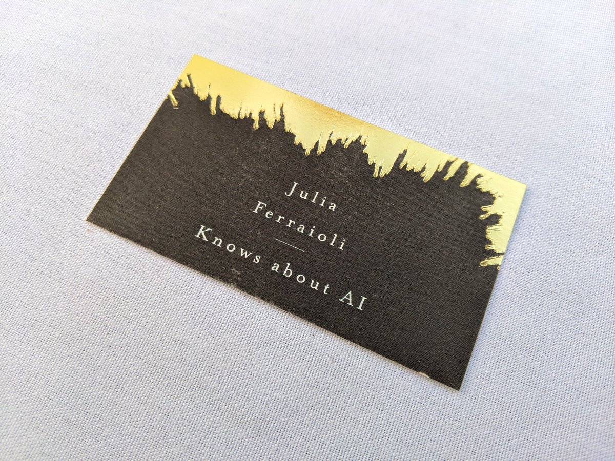 A place card from a wedding that has my name and underneath says "Knows about AI".