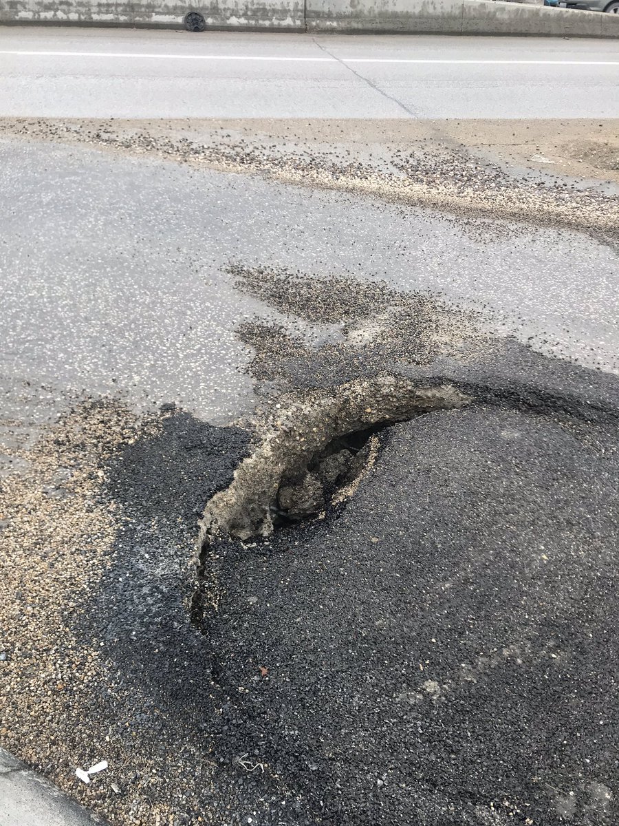 BethanyDaman's tweet photo. Hey @cityofwinnipeg, this hole has gotten a lot worse (Assiniboine/Osborne). Worried about the many cyclists who take this corner of everyday. @WpgBikeAlerts https://t.co/1JfTUM6Mn6