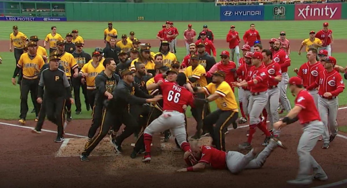 Kentuckyweather's tweet photo. The Reds may stink right now, but this pic of Yasiel Puig trying to fight the entire Pirates team is amazing. https://t.co/IeyqgBtPQY