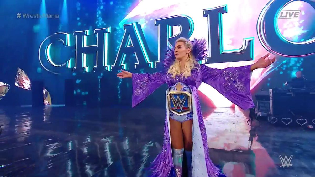 WWENewsExtra's tweet photo. SHE MADE IT.

#SDLive #WomensChampion @MsCharlotteWWE is in the building! #WrestleMania https://t.co/AEWqvdsekY
