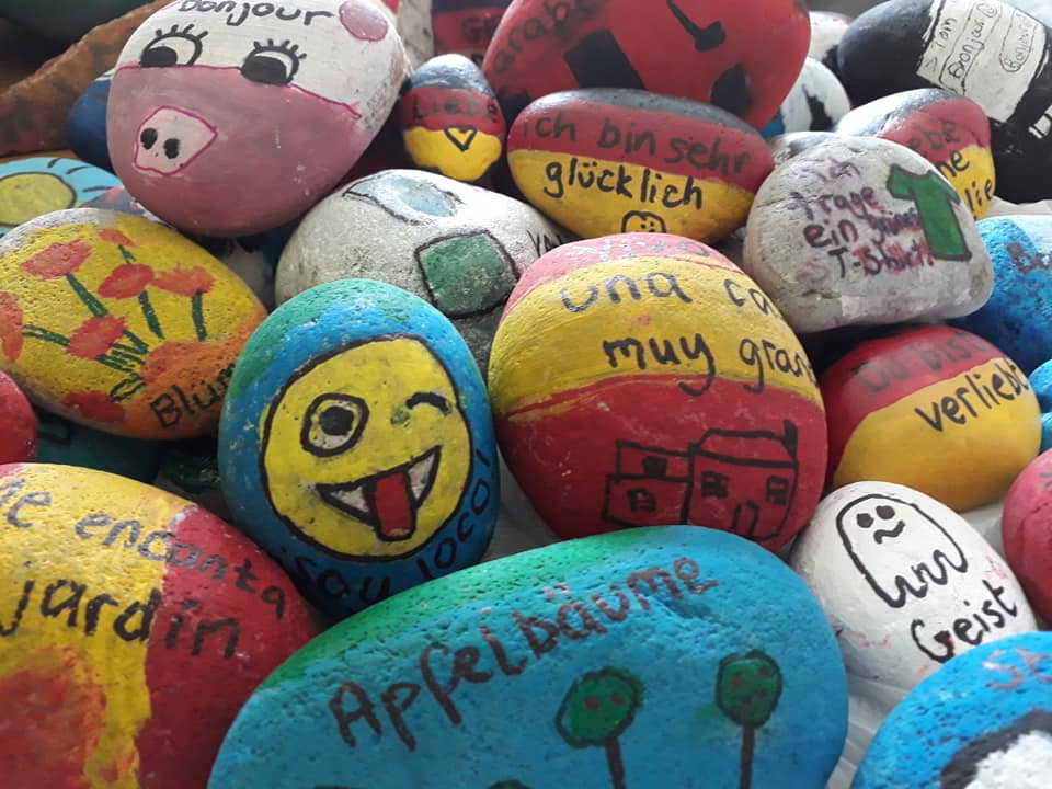 Finishing touches to the #LanguageStones made by RMS students. Then they'll be ready to fly! #mfltwitterati