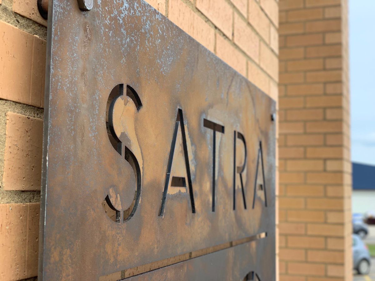 sottltd's tweet photo. We love this new COR-TEN @satratec
building sign we produced to celebrate 100 years of expertise. This stable 'rusted' effect panel with illumination is such a great contrast to their current signage. #rusted #aged #signage #building #satra #contemporary #CORTEN #celebration https://t.co/pzRQlJouJr
