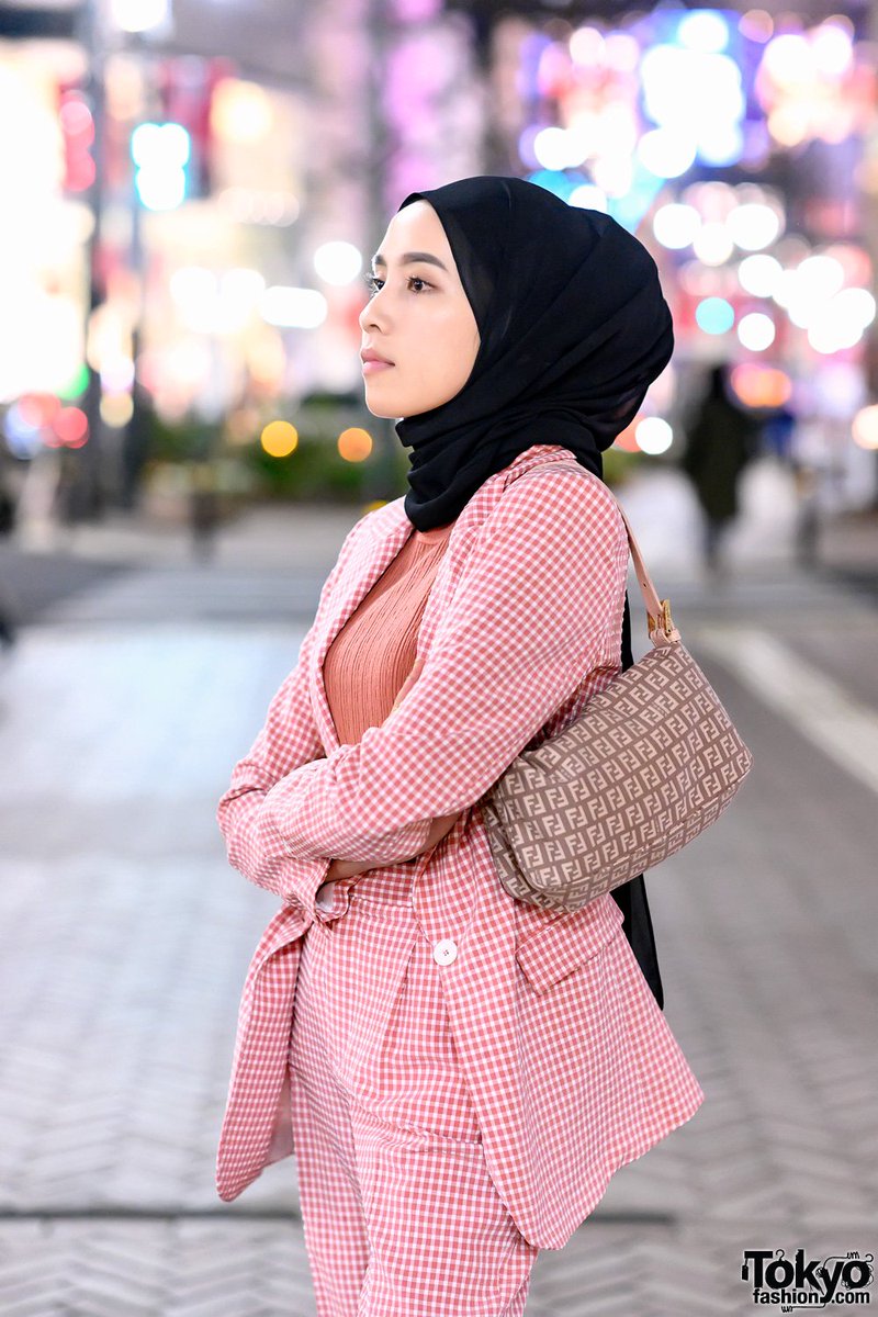 TokyoFashion's tweet photo. Amelia Elle, a hijabi fashion blogger from Indonesia, on the street in Shibuya, Tokyo wearing a pink check Zara suit, Fendi logo bag, and pink Chanel sneakers #渋谷 https://t.co/DWhiXCahsB https://t.co/8TvbXykERr