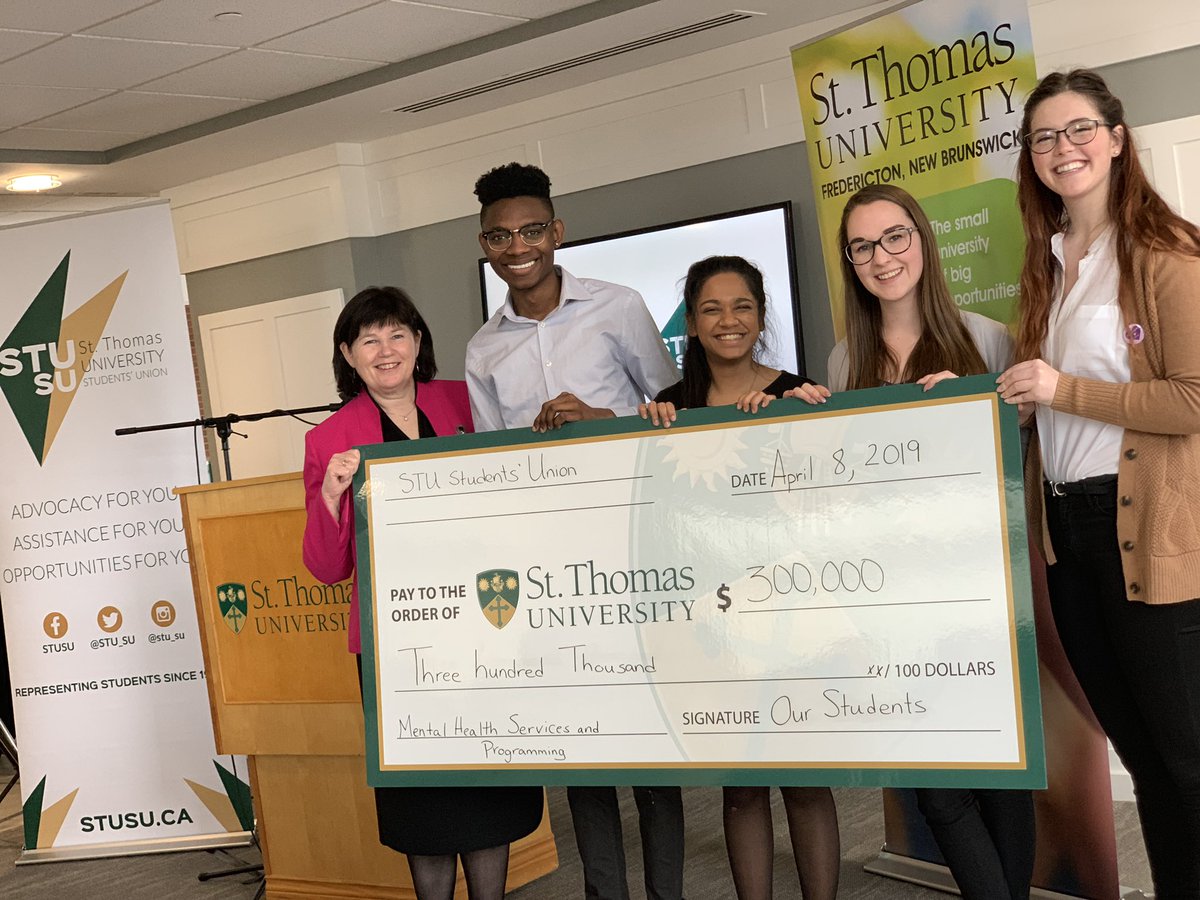 Members of the <a href="/STU_SU/">STU Students' Union</a> presenting President Dawn Russell with the donation toward mental health services and programming on campus. #StThomasU