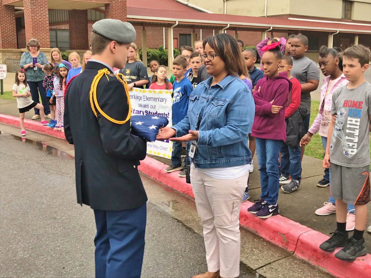 Heritage Elementary today honored students w/ parents in the military. Ambassadors from the eS2S (student-to-student mentoring group) led military kids to the flagpole where Jr. ROTC from JCHS conducted a ceremony. Everyone wear purple April 18 to honor military kids. #mcslearn