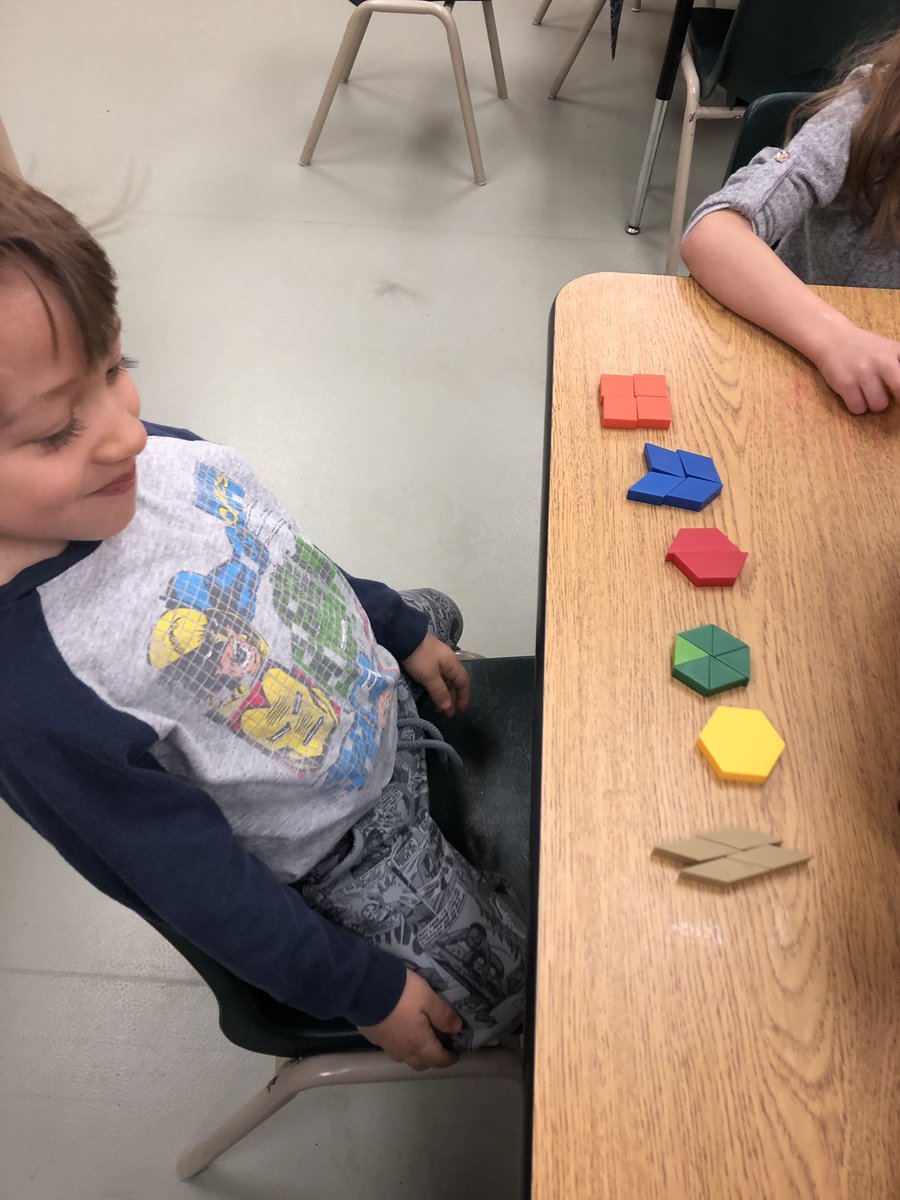 SLRMRSSB's tweet photo. Beginner understanding of fractions shown by two students today! You can make a hexagon with one pattern block, 2, 3 or 6 and they look exactly the same as the first one! #mathmornings https://t.co/05GnCEvt4x