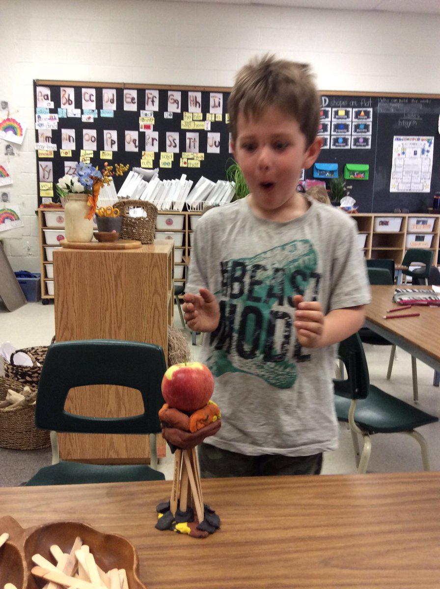 Kat_runz's tweet photo. Today we challenged our kinders to build a structure with only popsicle sticks and clay to hold an apple. “Ms. Showler, this is impossible!” They made it possible once they got to work! @SouthRidgeTVDSB #stem #madeitpossible #kindergarten #thoseexpressions #theywereproud https://t.co/or6uyNavoZ