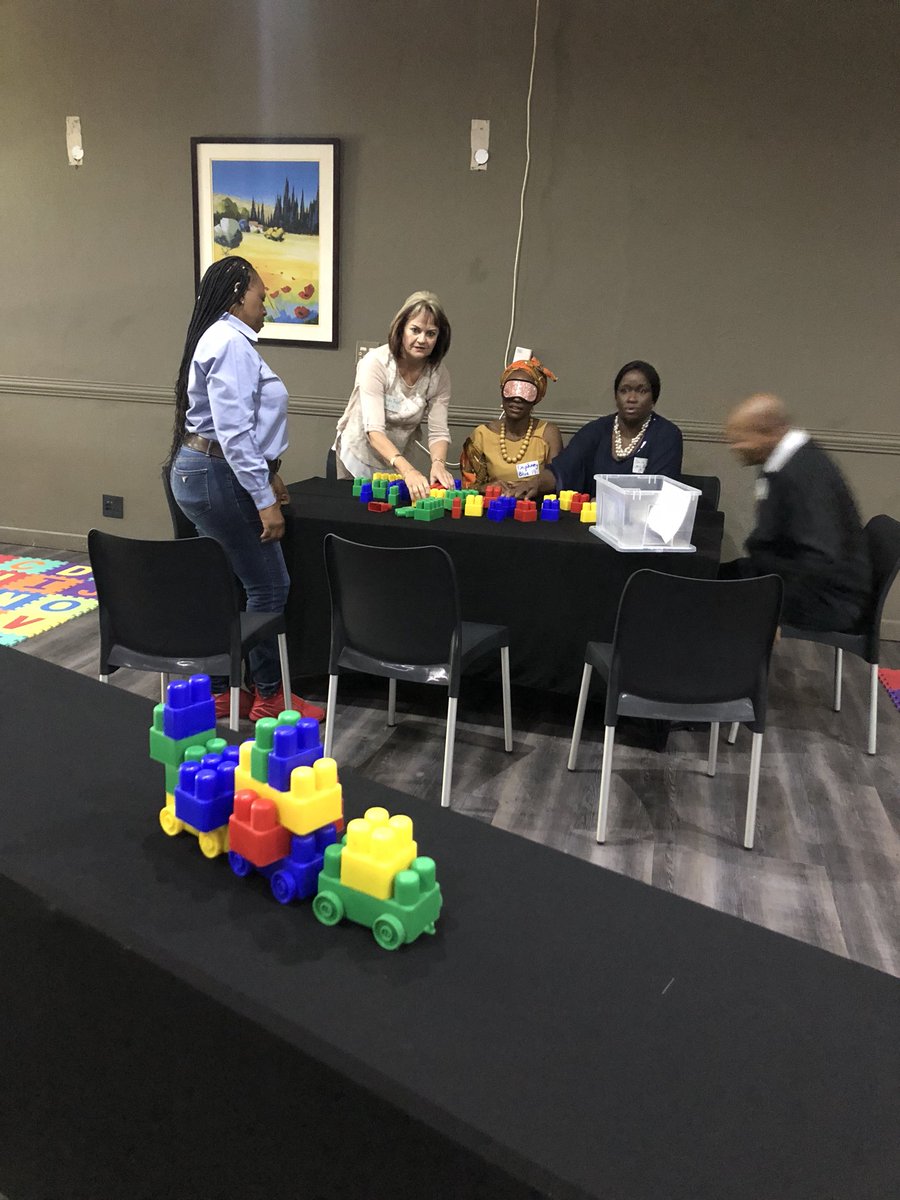 The_NECT's tweet image. Experience 1 begins: Blindfold LEGO. This activity is teaching district officials collaboration, communication &amp;amp; Critical thinking which forms part of the 4Cs of C21 #C21SandboxSchoolsProject #CommittedToEducation