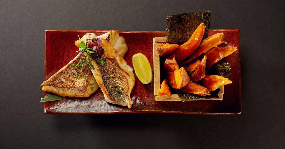 A Japanese twist on a British staple: Fish &amp; Chips Ukai style - pan fried sea bass &amp; sweet potato fries.