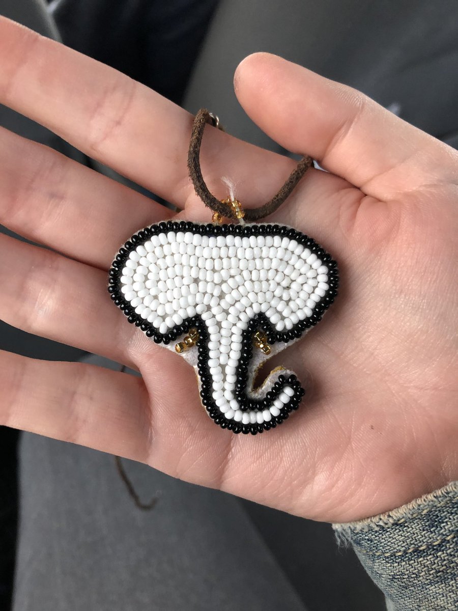 beadagainstfash's tweet image. Loooooook!!!! It’s the first beadwork I ever gifted to anyone!! It’s an elephant silhouette on deer hide I beaded for my brother 🖤 it’s his fave animal, and he keeps this in his car for good luck 😌
