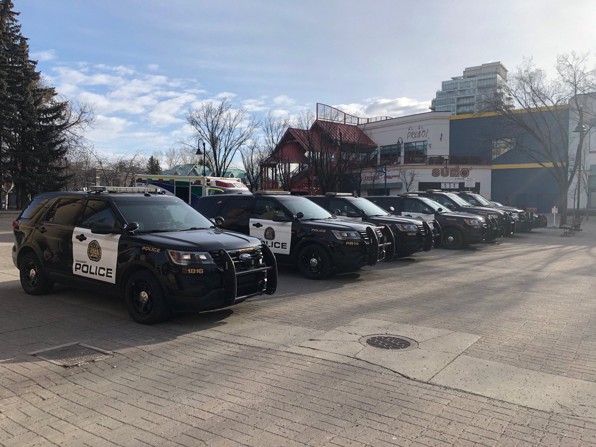 A fleet of #calgarypolice vehicles at Eau Claire plaza as they prepare for bill #C69 protests