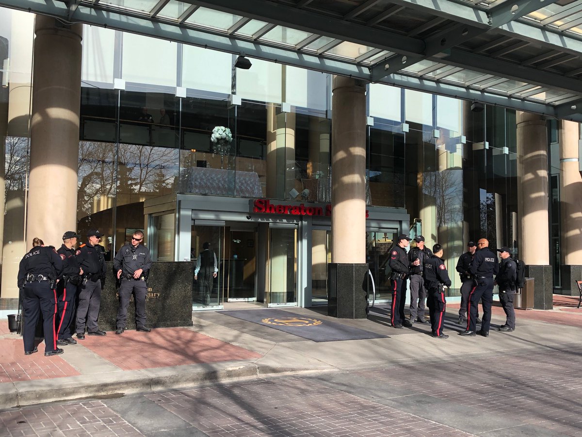 #calgarypolice flank the entrance to the Sheraton Eau Claire preparing for bill #C69 protesters. Meanwhile inside the hotel Rachel #Notley speaks to senate committee. @ctvcalgary