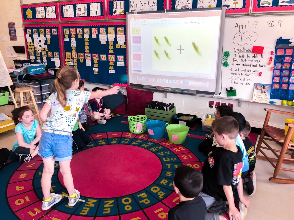 MissChelseaHara's tweet photo. During today’s math lesson we played a game where we had to find the sum of the addition problem and then throw the ball into the correct bucket! 🤓 https://t.co/cWzmkYSumA
