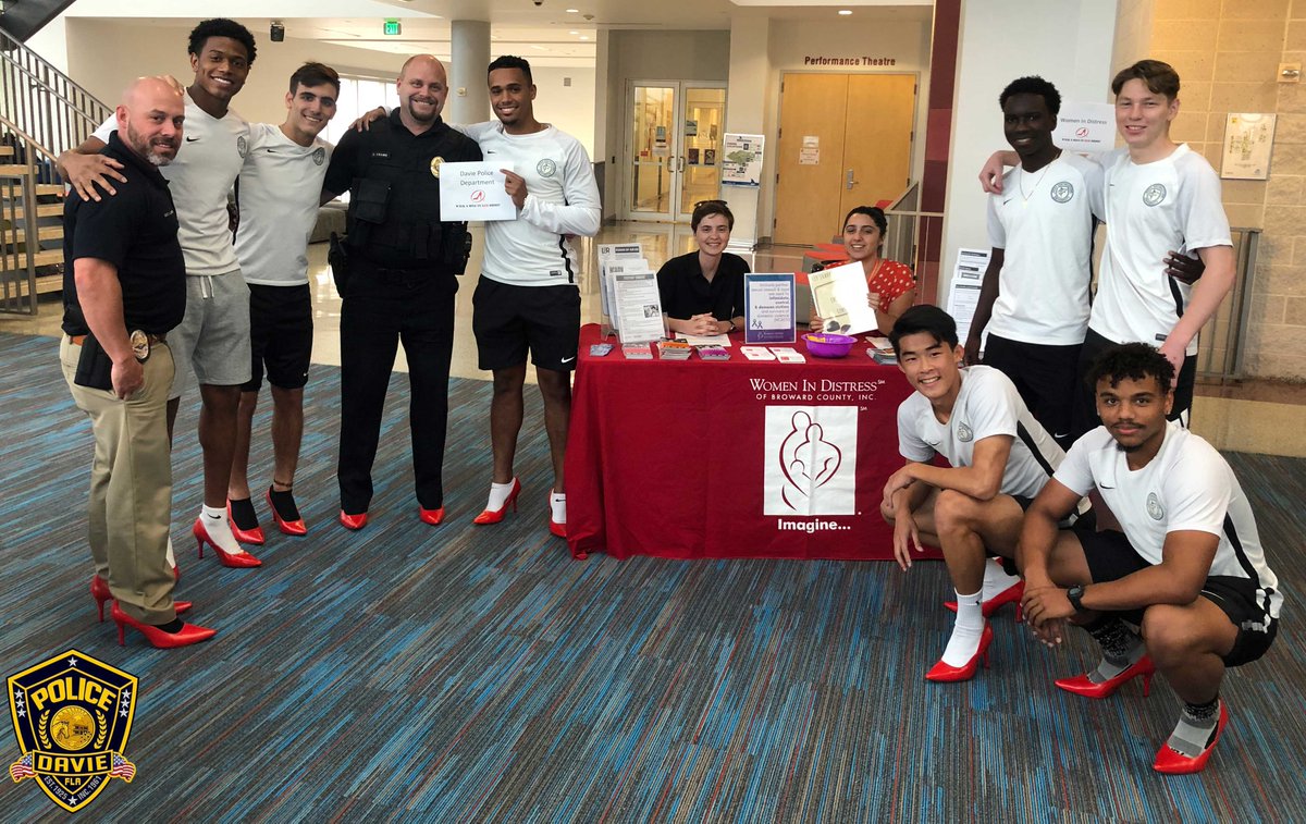 DaviePolice's tweet image. The "Walk a Mile in Her Shoes" event at @NSUFlorida was held to raise awareness about the serious causes, effects, and remediations to men's sexualized violence against women. Members from the #DaviePolice put on the red shoes and walked!