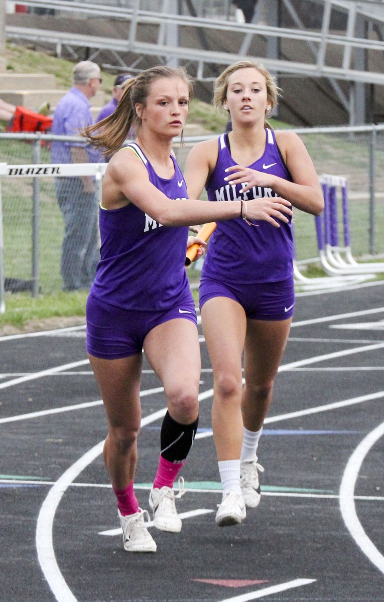 SCIStephanie's tweet photo. TR: Jessica Hollist of @MilfordEagles takes the baton from Makena Stutzman in the 4x400-meter relay. #milfordsoar #relayrunner https://t.co/Pf0biQKKO7