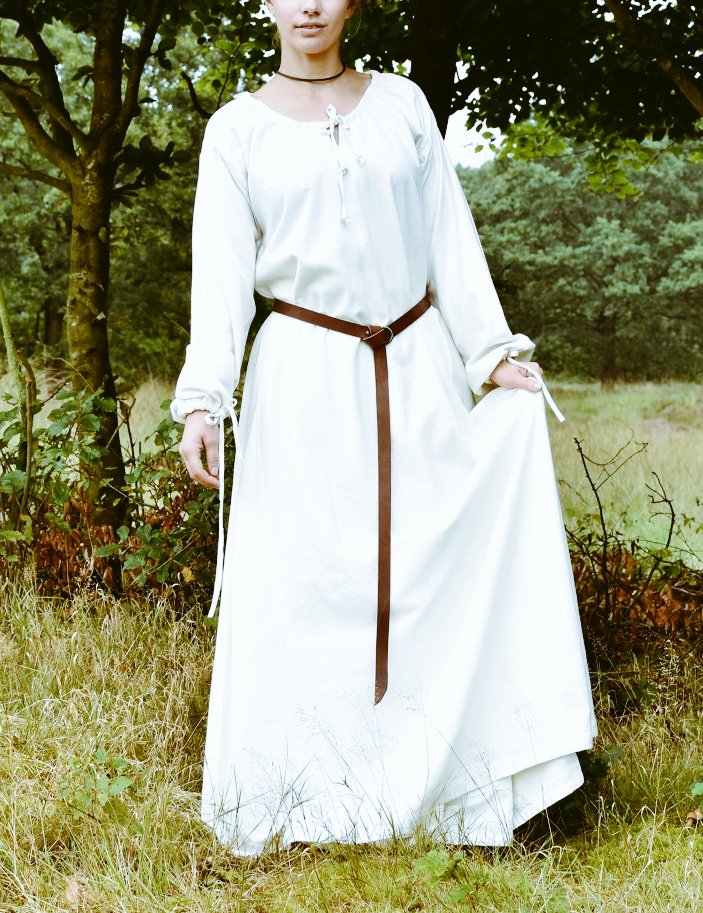 Her wedding dress was pure linen with a belt specially made for her and a little crown of Roses, She stepped out walking towards the Ceremony.