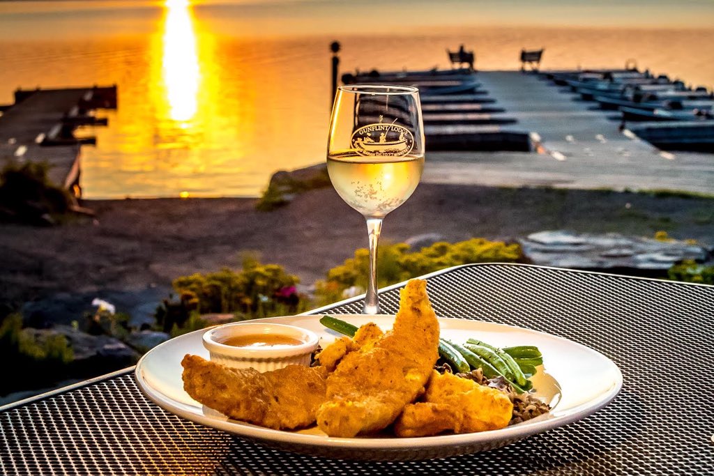 GunflintLodgeMN's tweet photo. @exploreminn We happen to be the home of Justine's, a bistro and fine dining experience overlooking Gunflint Lake and named after Justine Kerfoot herself. Pick a table out on the patio to enjoy our Sunday BBQ, grab a drink and witness one of the best sunset's Minnesota has to offer. #OnlyInMN https://t.co/mklTTSl7Sc