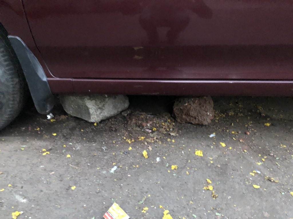 VibhavRoy's tweet photo. @bmcmumbai if we remove the stones and park, she damages our cars and also shoves stones under the vehicles. If we park on the main road, traffic police tow the cars away as metro construction and hawkers already cramp the road. Please help us. https://t.co/8NJR83HLpg