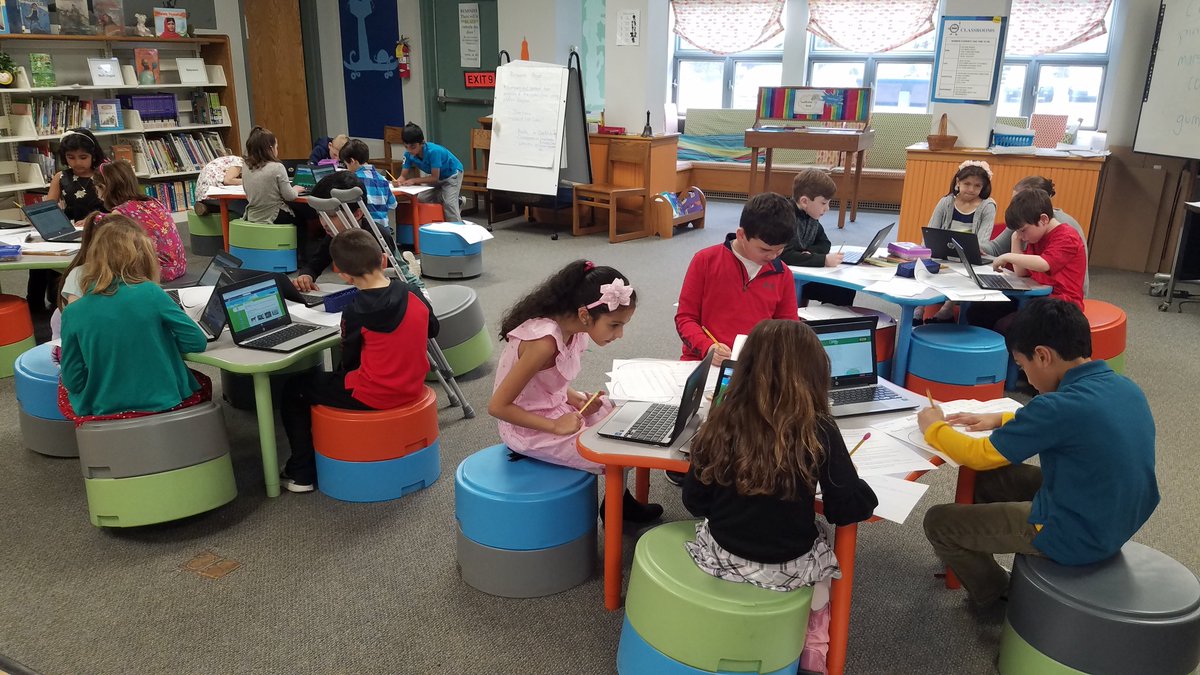 Project-based research projects are fun! Mrs. Secatore's second grade class working on their library research project.