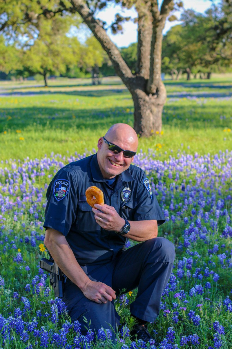 blanco_isd's tweet photo. #BISDSRO Harris joins the #BackTheBLUEbonnets challenge and shows the community one of the safest spots for Blue Bonnet Pictures! Our wildflowers are beautiful along HWY 281, but the field behind the MS is a perfect #safespot for wonderful pictures.  #officershavefuntoo https://t.co/c9ZGFDphk6