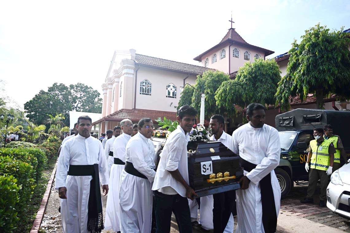 NavamaniLK's tweet image. Mass funeral commences at Katuapitiya St. Sebastian church, the scene of the heinous terrorist attack