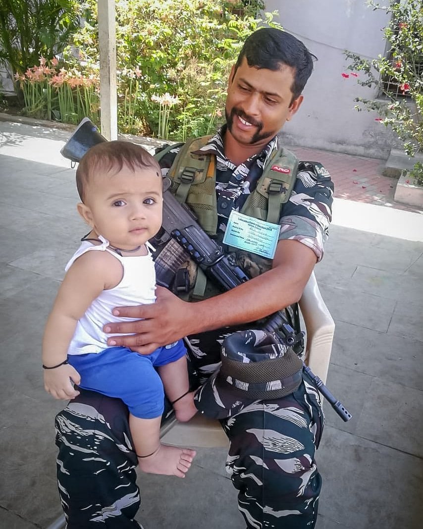 CUTENESS OVERLOAD: Well the EVMs will have to wait before this little kid casts vote. However, the kid is happily observing the process in safe hands.

Kid enjoying the company of CRPF while the mother votes.

@ECISVEEP#DeshKaMahaTyohar #MyVoteMatters #YourVoteMatters