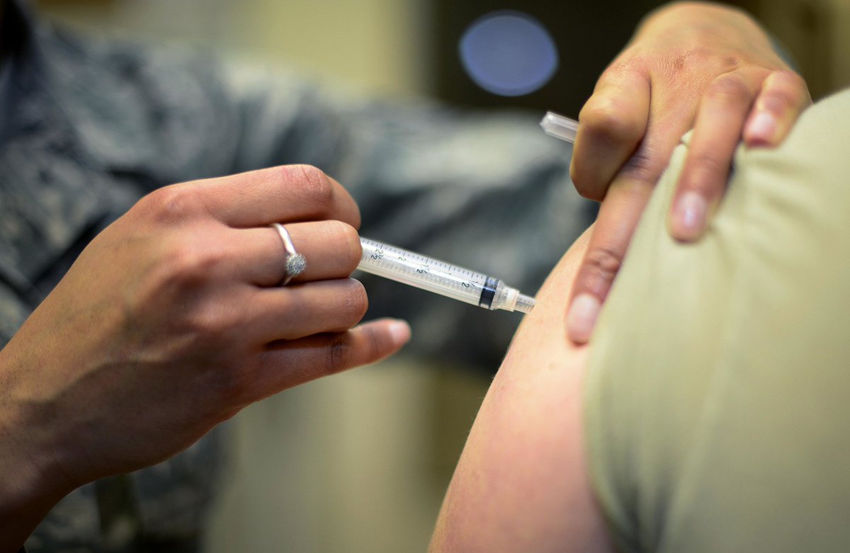 Person receiving a vaccine shot