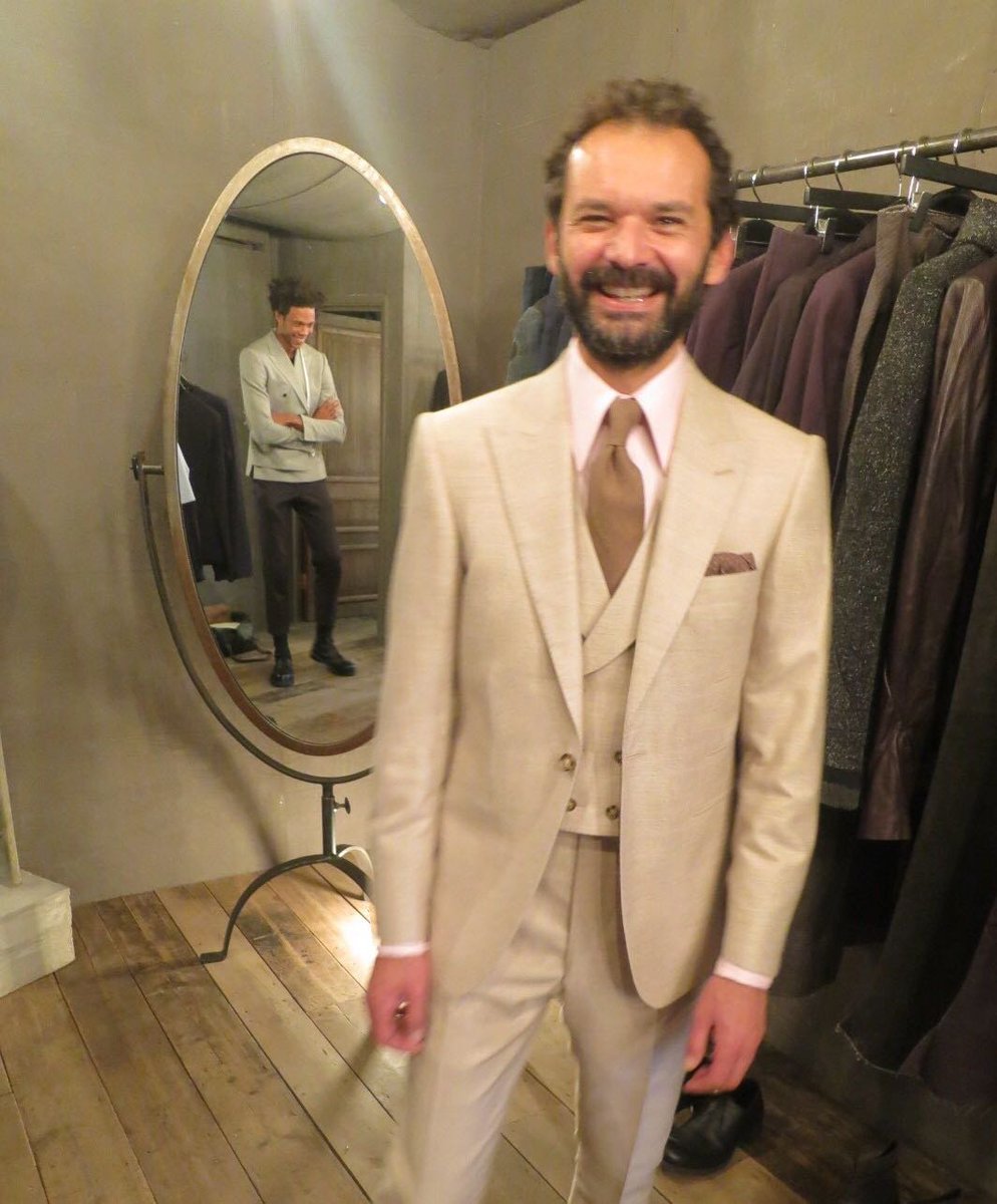 Mr. Rowan Chernin wears an Ariston silk mix DIMITRI three-piece suit featuring a soft, sloping shoulder and rope sleeve head.