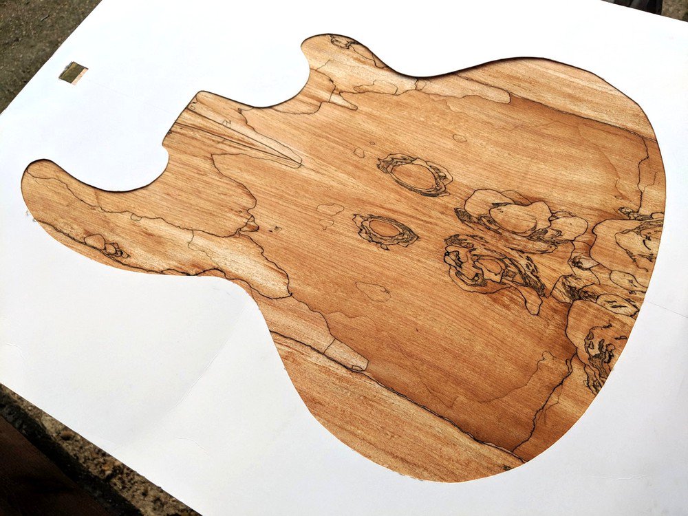 Using a Mk2 shaped mask to help choose the best orientation for these book-matched spalted maple facings.