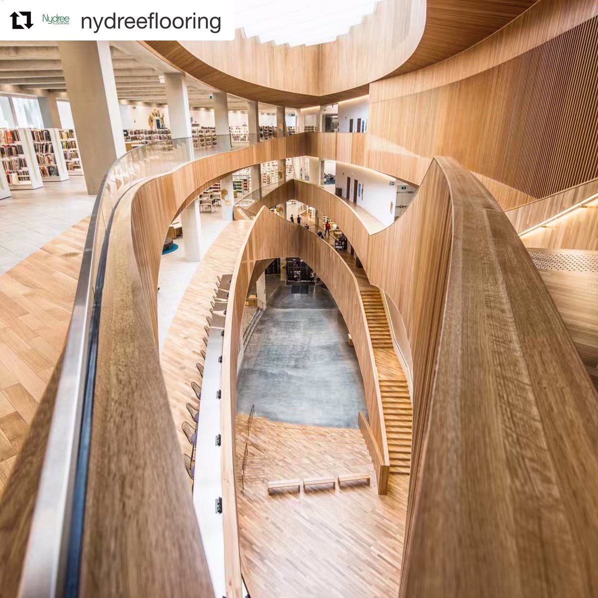 KibaContract's tweet photo. The brand new @calgarylibrary is an #architectural #marvel and @NydreeFlooring’s largest project to date! Their acrylic-infused natural wood products provide the look and feel of genuine hardwood flooring with a durability developed specifically for high traffic commercial use. https://t.co/Zer7AIa0EI