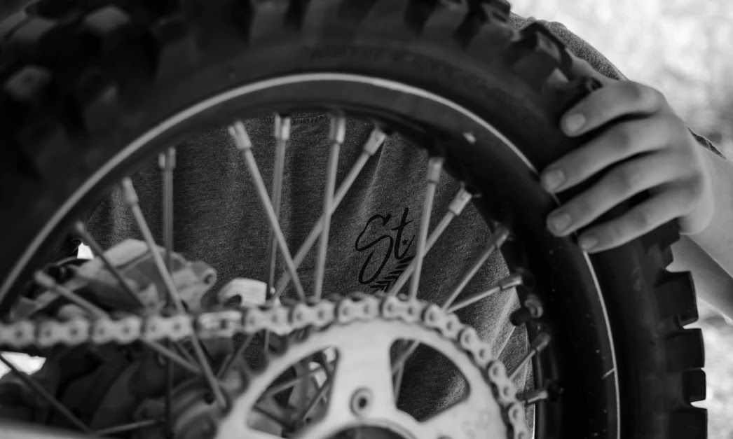 standardcloco's tweet image. Sniper shot of the logo through the spokes for the win by our girl BNC 📸 💯 #StandardCloCo #SolidFoundations #ConstructingNewLevels