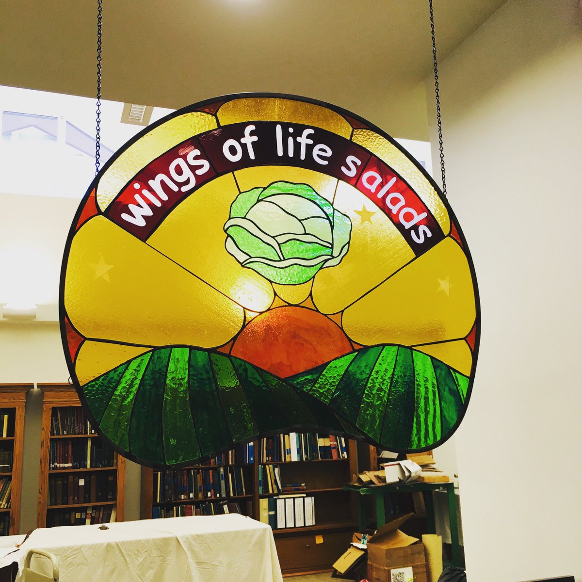 TompkinsHistory's tweet photo. The Wings of Life salads sign is up! Thanks @wegmans for donating and Sarah of @ithacaisfoodies for making it happen. The sign originally said Cabbagetown Café, its original home. Anyone know who created it? #twithaca #localhistory #cabbagetown #ithaca #newyork https://t.co/v7YSoltulc