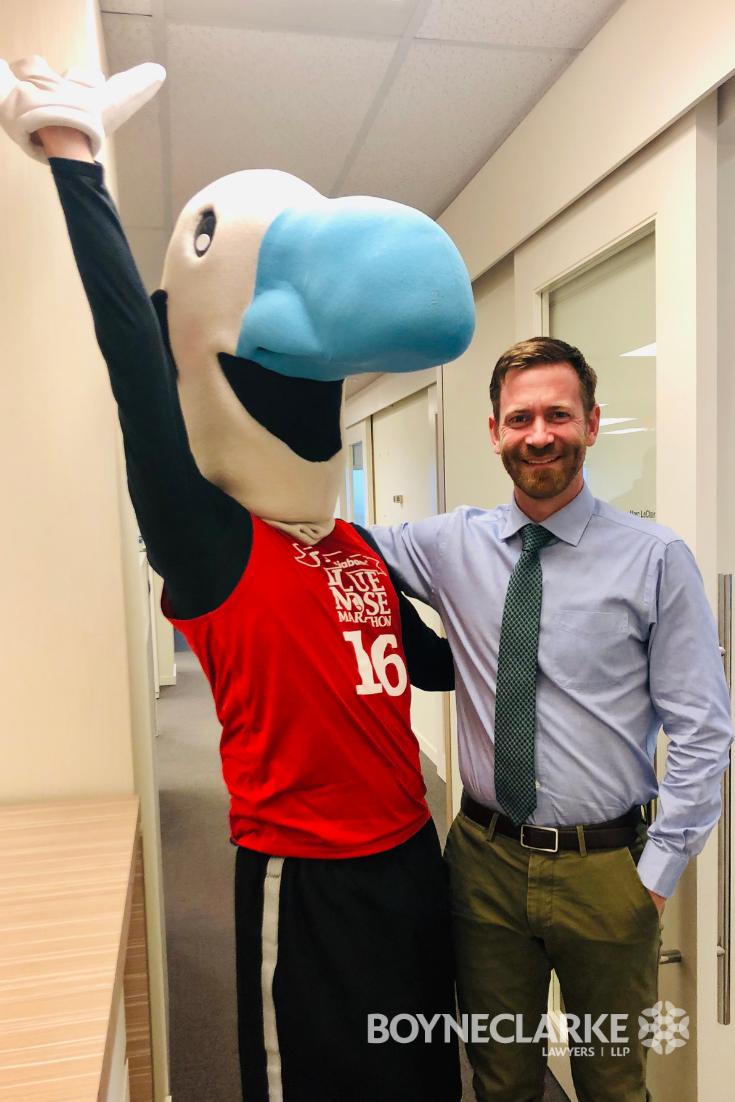 BOYNECLARKE's tweet photo. Myles stopped in to see if everyone at the office was getting ready for the BOYNECLARKE LLP 15km! We are very happy to be apart of the Scotiabank Blue Nose Marathon for our 2nd year as a sponsor! #Marathon #RunningwiththeLaw #BlueNose2019 #LetsGiver https://t.co/MM0jTlM8J0