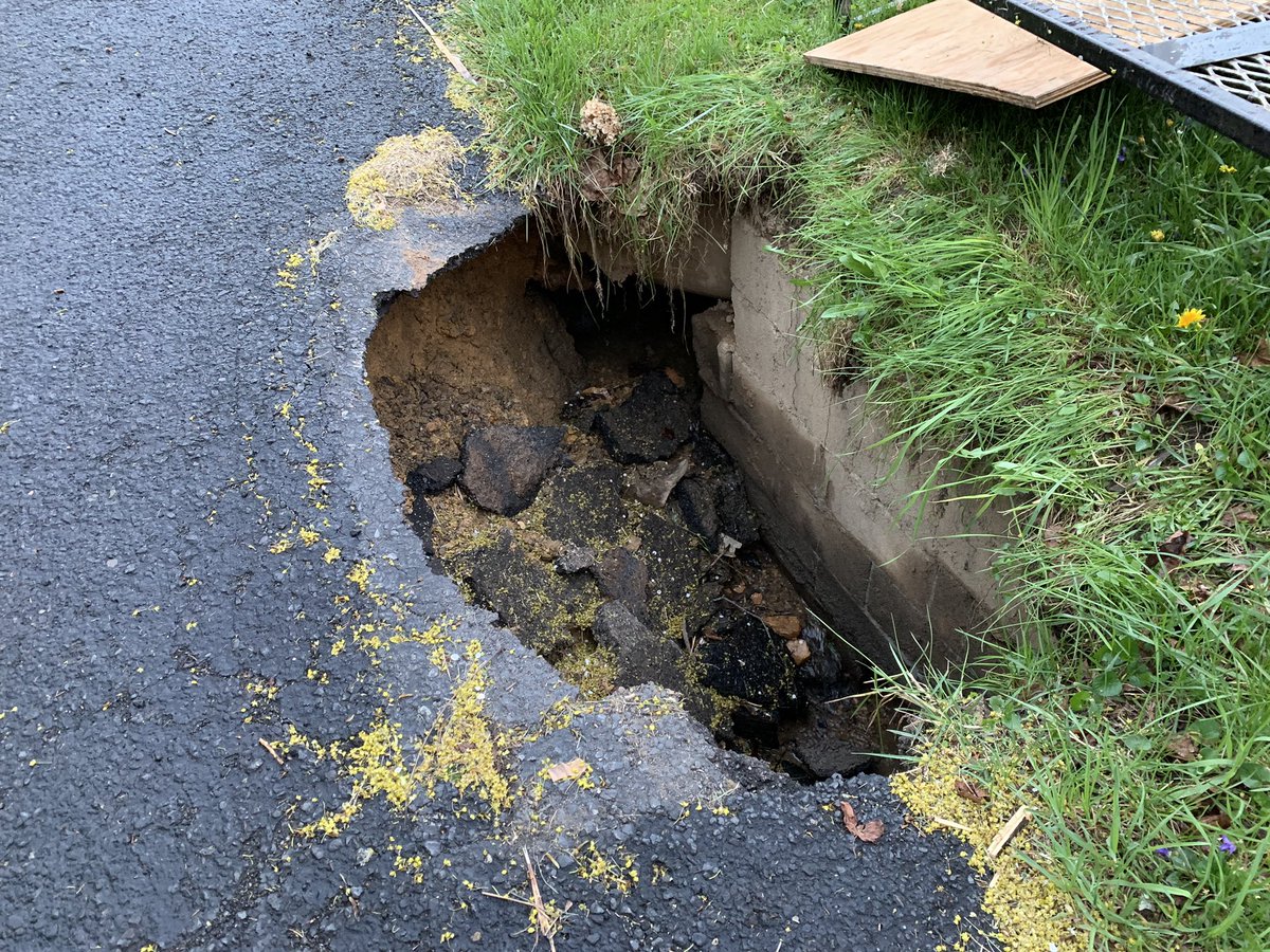 harryfike's tweet photo. Hey @realjakeshade I appreciate the time at the last commissioners meeting to share the issues with flooding in my neighborhood and the sinkhole that has formed. So far no progress on a resolution, but that’s not stopping the sinkhole from eating my driveway! Any suggestions? https://t.co/ODeJWtkbjL