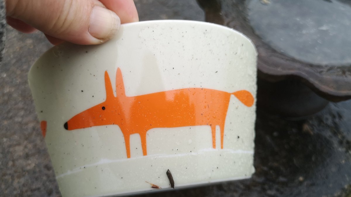 Bowl with stylised orange fox painted on it