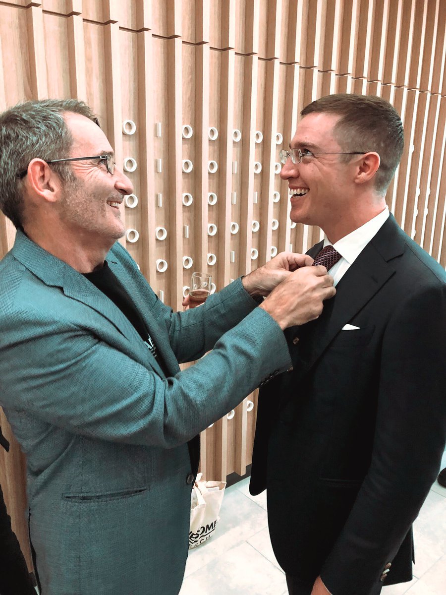 Audeara's tweet image. Caption this! 

One of our favourite images from #riverpitch. Mentor @stevebaxter prepping James,  Audeara CEO behind the scenes. 
That double windsor never looked so good! 

#audeara #stevebaxter #thecloakroom @RiverCityLabs