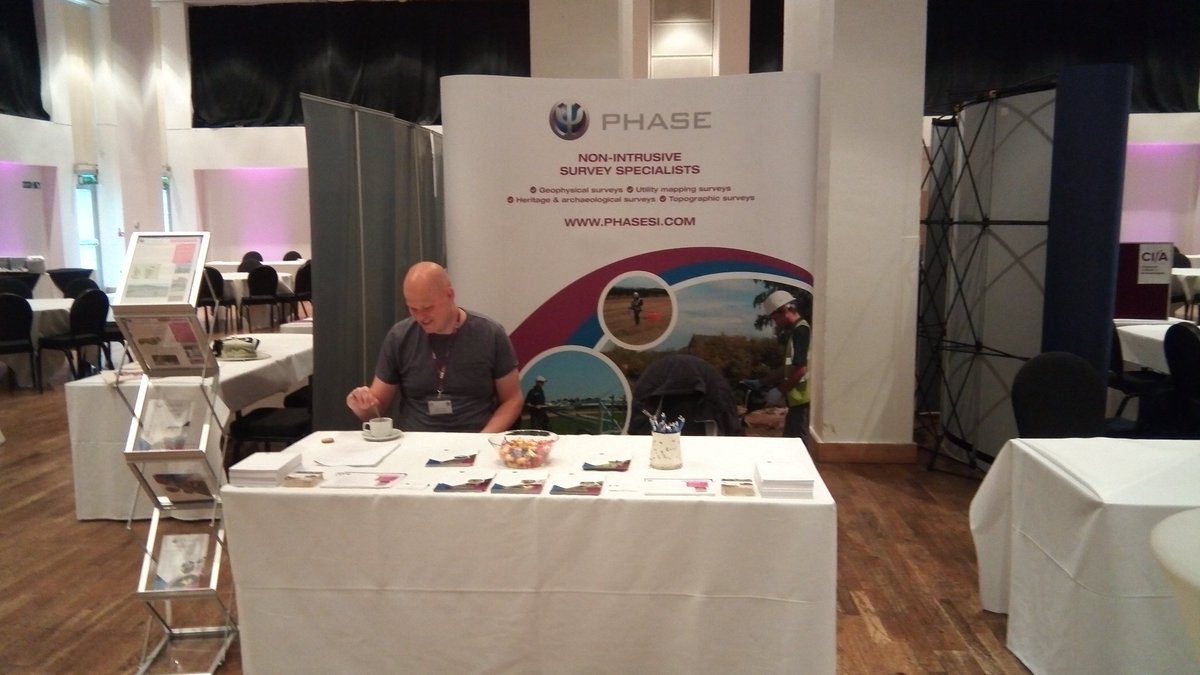PhaseSI's tweet photo. All set up at #cifa2019. Jelmer enjoying a coffee before the rush of people desperate to find out all about geophysics. We also have sweets ... https://t.co/yo8aLpbONa