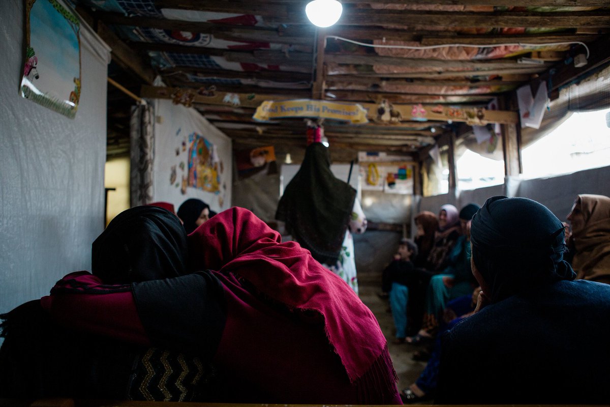 rosaauthor's tweet photo. Two #syrian women whisper to each other during an Arabic literacy class in a #refugee camp in Tyre, Lebanon. After 8 years of civil war, women of all ages lack the basics of literacy in their own language. .@CNSmd .@merrillcollege #merrillmade #newsphotography https://t.co/uLbk79mJLw