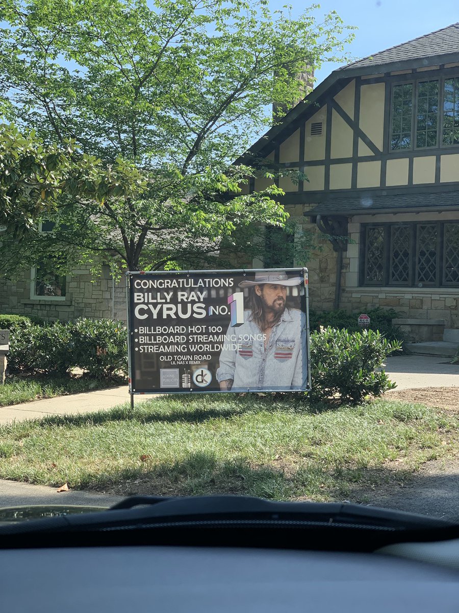 Damn. They took @LilNasX off the country charts but gave Billy Ray the congrats sign over here on Music Row in Nashville, TN.